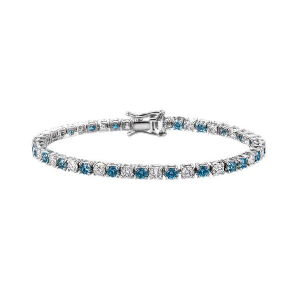 A tennis bracelet featuring round-cut blue sapphires and clear diamonds set in a silver-colored metal, shown against a plain white background.
