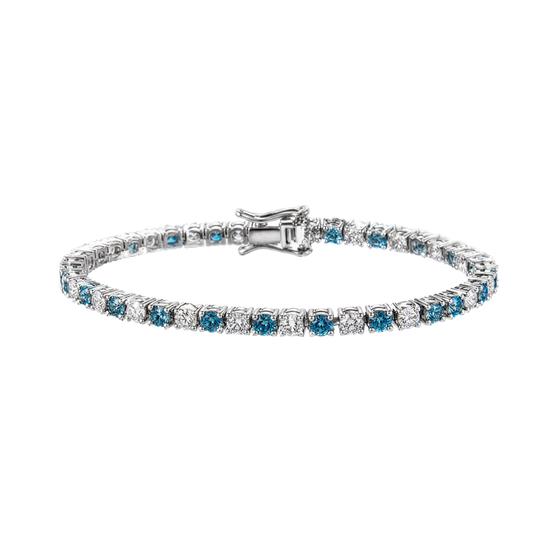 A tennis bracelet featuring round-cut blue sapphires and clear diamonds set in a silver-colored metal, shown against a plain white background.